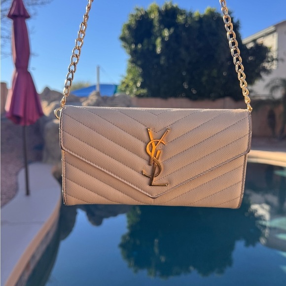Yves Saint Laurent Handbags - Yves Saint Laurent Cream Quilted Clutch with Gold Chain